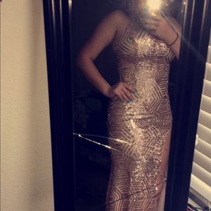 Gold sequin formal dress with leg slit.